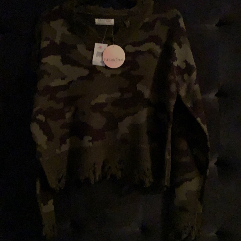 Green V-neck sweater